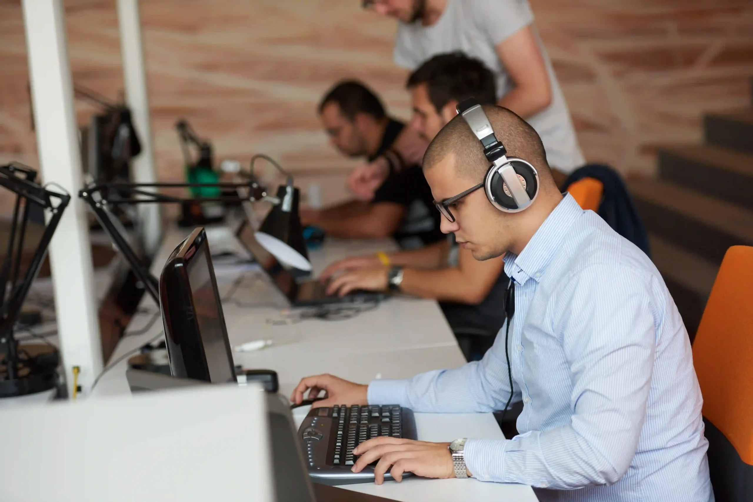 Outsourced IT support services team assisting business users