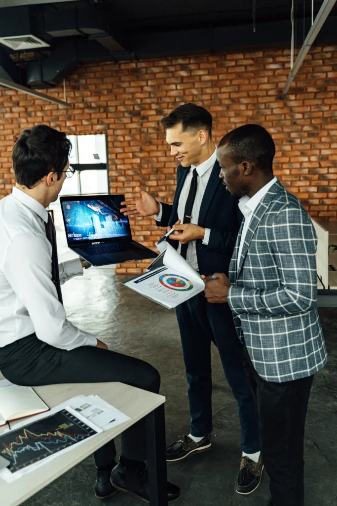 Technology strategy team reviewing business reports and digital insights